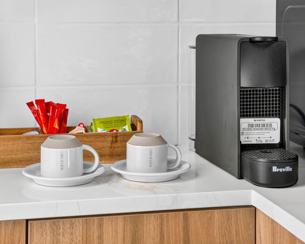 Coffee station beside the kitchenette in a Standard Queen Studio at Tiana Beach Inn