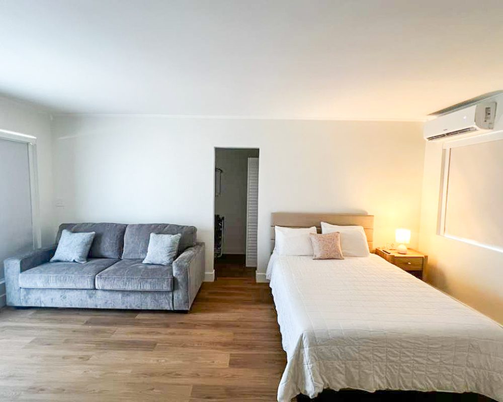 Deluxe Room with modern decor and private kitchenette at Tiana Beach Inn Hollywood Beach Florida